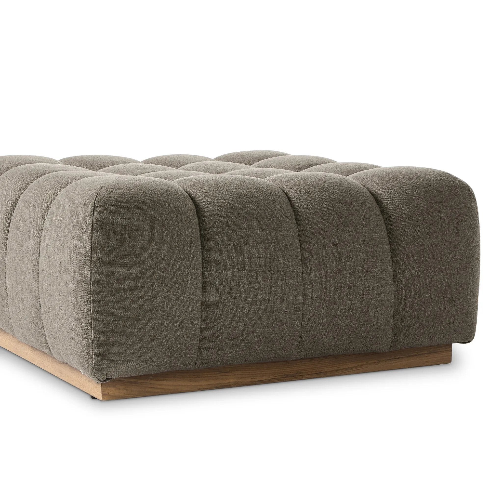 A modern take on mid-century Italian design, soft volume and exaggerated proportions fuse for a sculpted look and playful feel. Atop a plinth-style teak base, outdoor-friendly ottoman features dramatic tufting for a padded sit or a tray for use as a table, indoors and out. Ottoman to matching sectional. Amethyst Home provides interior design, new home construction design consulting, vintage area rugs, and lighting in the Park City metro area.