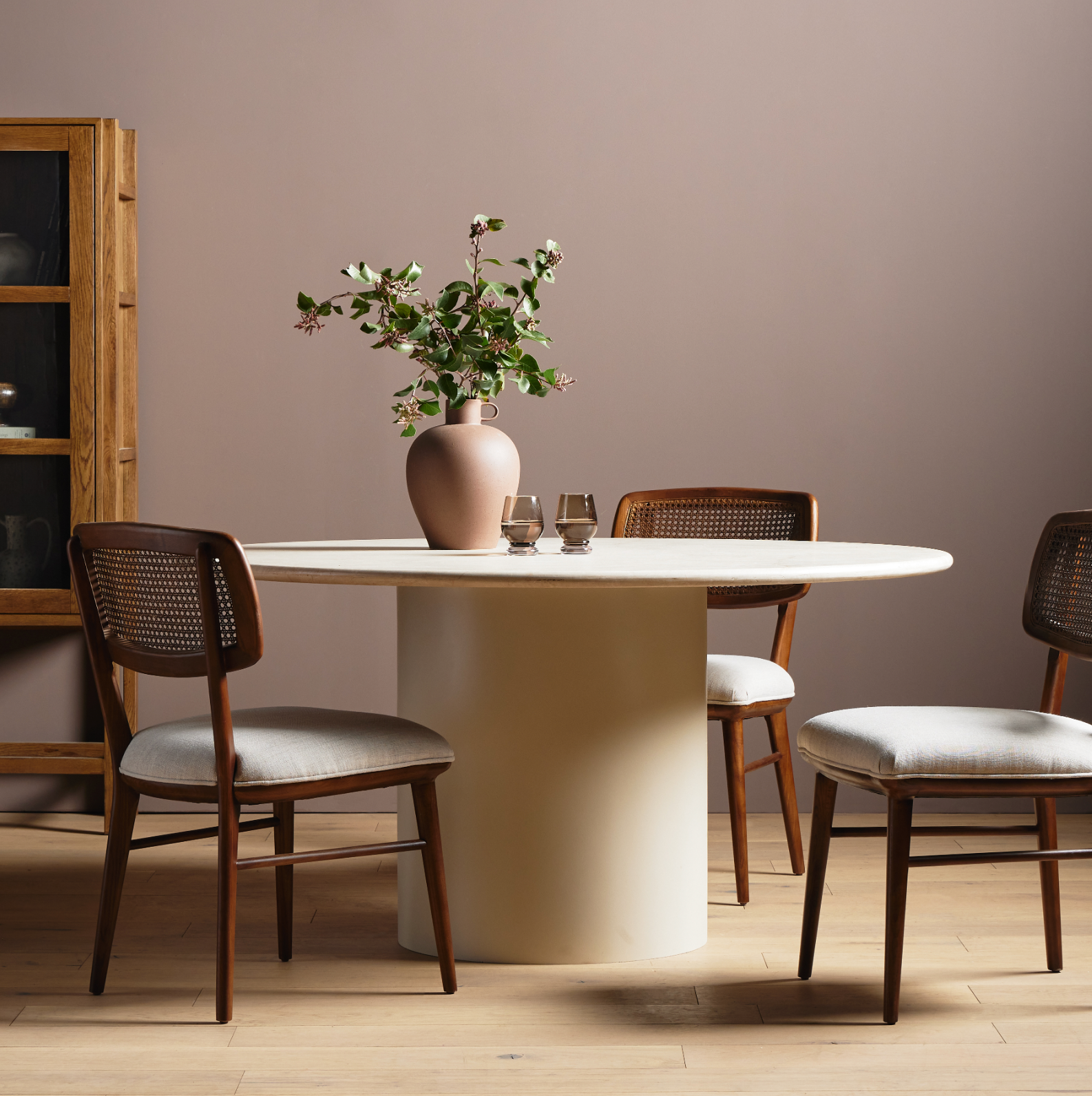 Simply sophisticated. A bistro-style table inspired by 1970s Italian design, an ivory-finished iron base supports a rounded tabletop of cream-colored solid marble, for a fresh, monochromatic look that pairs with just about anything. Amethyst Home provides interior design, new construction, custom furniture and area rugs in the New York City metro area