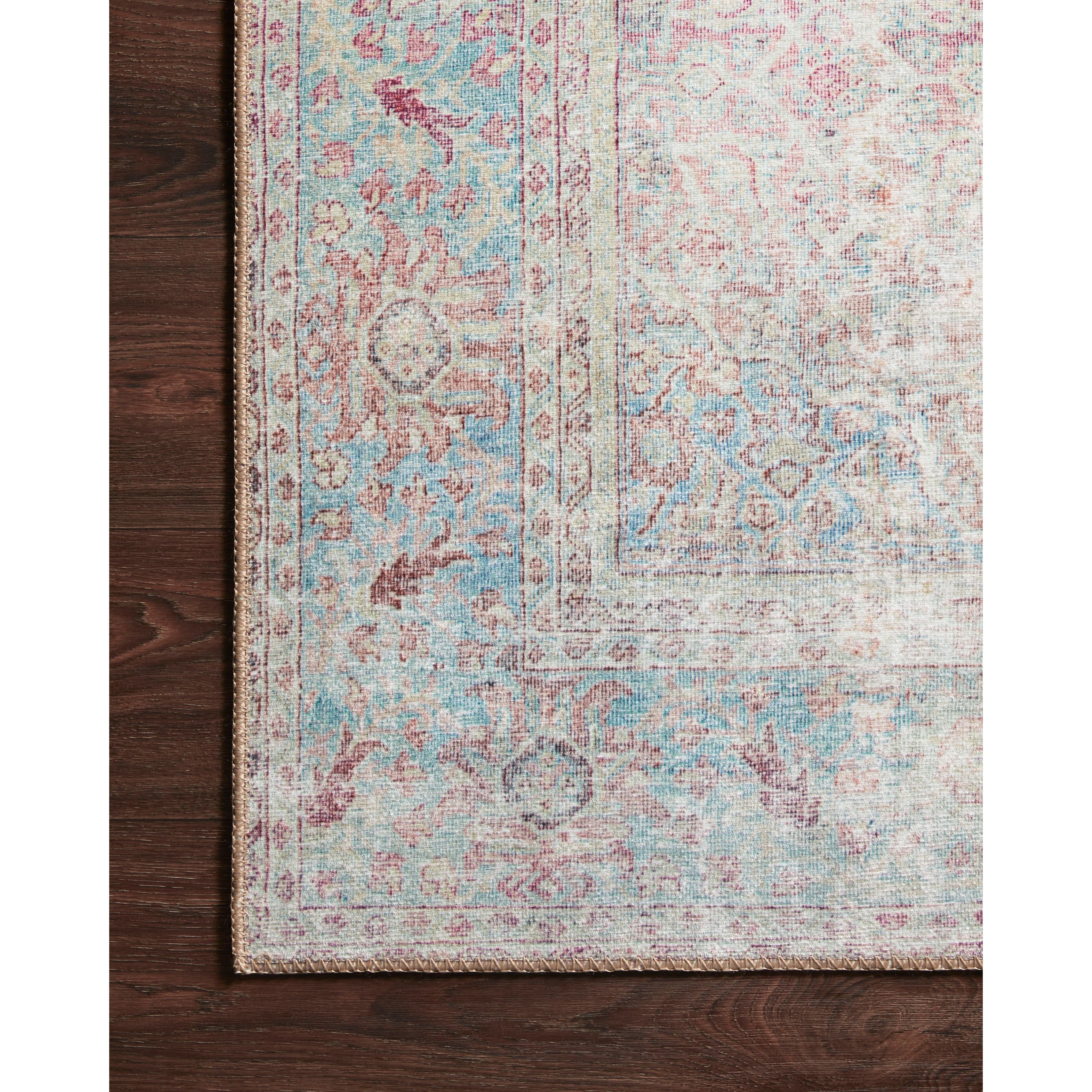 The Wynter Red / Teal area rug showcases a one-of-a-kind vintage or antique area rug look power-loomed of 100% polyester. This rug brings in tones of pink, ivory, and blue. The rug is ideal for high traffic areas due to the rug's durability for living rooms, dining rooms, kitchens, hallways, and entryways.