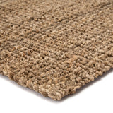 This hand-spun jute Naturals Lucia Achelle Area Rug by Jaipur Living, or NAL03, offers a neutral foundation to transitional homes. Perfect for textile layering and coastal appeal, this texture-rich natural layer lends an eco-friendly accent in a warm-toned taupe hue.