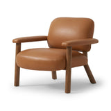 Sleek and inviting, this wood-meets-leather arm chair is timeless in any context. Large cylindrical legs support the upholstered back and seat, which are covered in camel-colored top-grain leather. Spring suspension adds comfort and durability to the seat cushion.Collection: Carnegi Amethyst Home provides interior design, new home construction design consulting, vintage area rugs, and lighting in the Calabasas metro area.