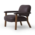 Sleek and inviting, this wood-meets-leather arm chair is timeless in any context. Large cylindrical legs support the upholstered back and seat, which are covered in bark-colored top-grain leather. Spring suspension adds comfort and durability to the seat cushion.Collection: Carnegi Amethyst Home provides interior design, new home construction design consulting, vintage area rugs, and lighting in the Charlotte metro area.