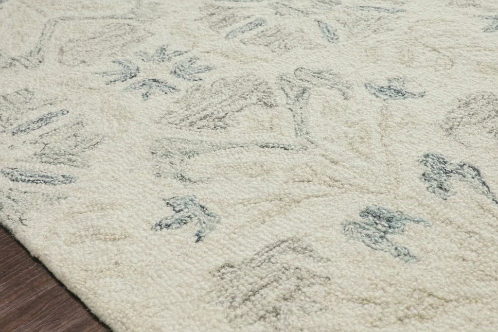 Hooked of 100% wool pile by skilled artisans in India, the Norabel Collection feels naturally soft underfoot. Norabel features designs that balance botanical motifs in delicate, variegated colors that resonate for today's home.  Hooked 100% Wool NOR-02 Ivory / Grey