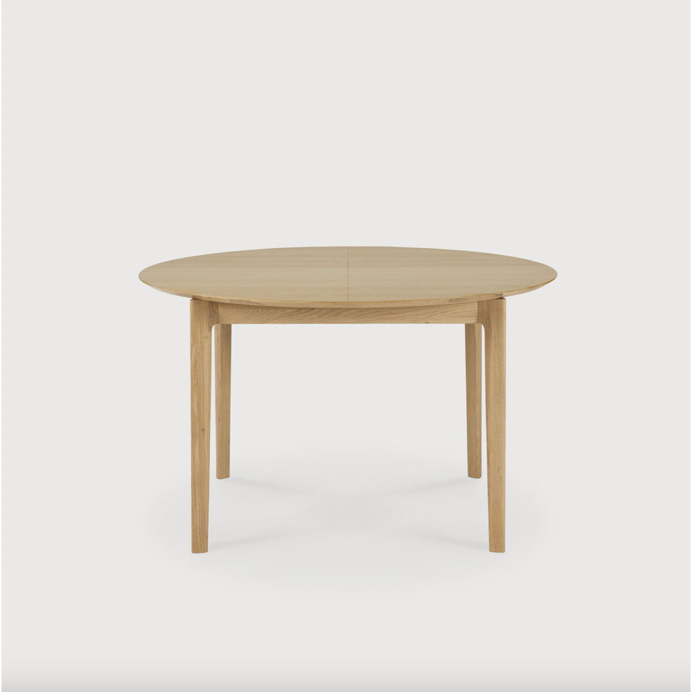 This Oak Bok Round Extendable Dining Table offers the perfect solution for adaptable dining within a smaller space. The iconic airy shape and solid construction make for a timeless design to enjoy for years to come.  Material: Oak, 100% Solid Wood Finish: Oiled