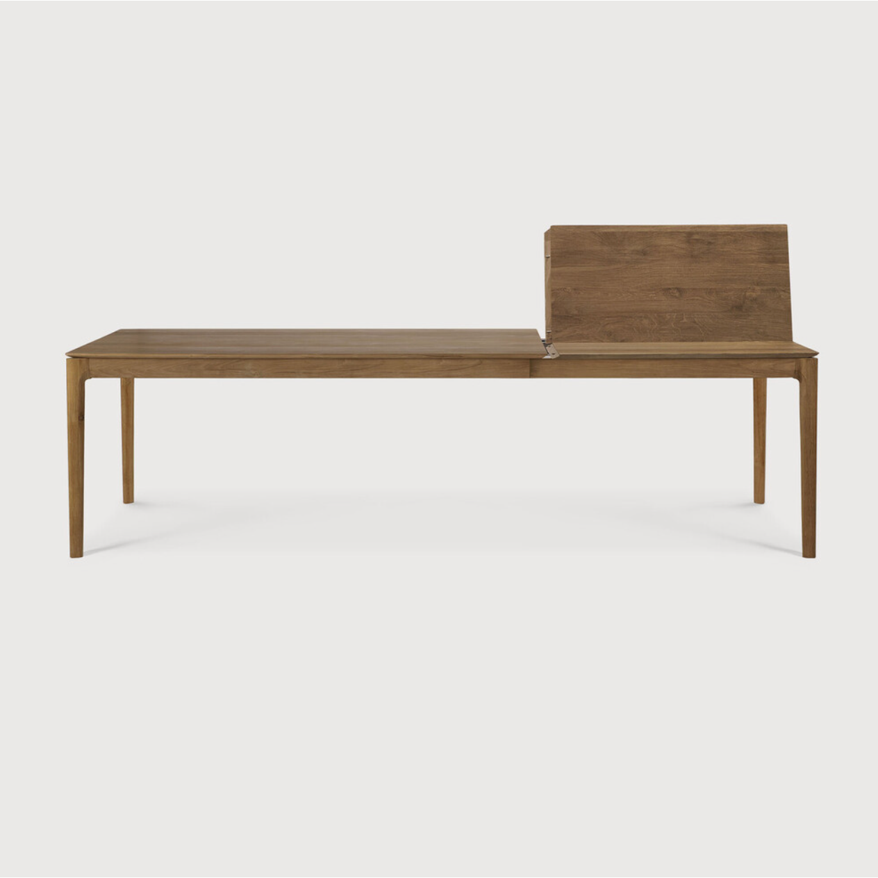 This Oak Bok Extendable Dining Table is perfect for families who want extra space when their kids, extended family, or guests come to celebrate! Its airy shape yet rock solid construction make this piece a timeless and remarkable design to enjoy for years to come.  Material: Oak, 100% Solid Wood Finish: Oiled