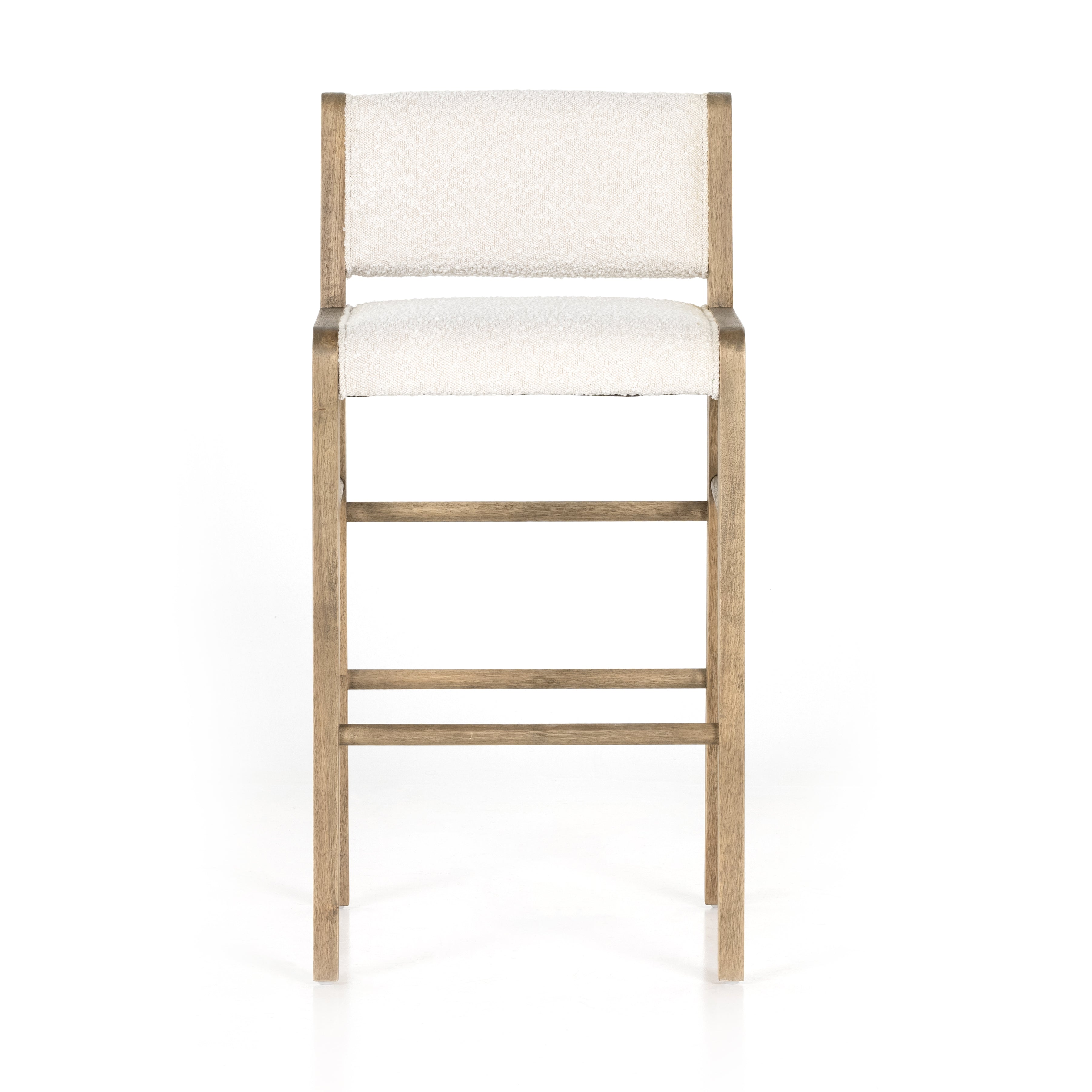 We love the mixed materials found in this Charon Bar + Counter Stool. In a light, natural finish, solid parawood forms an angular frame for boucle-upholstered seating in a classic cream.